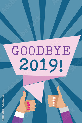 Writing note showing Goodbye 2019. Business photo showcasing New Year Eve Milestone Last Month Celebration Transition Man woman hands thumbs up approval speech bubble rays background photo