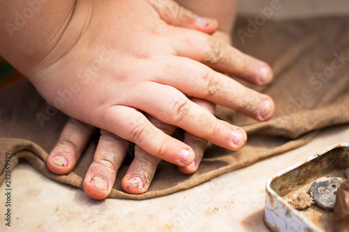 Children's hands make crafts from clay. Sculpt