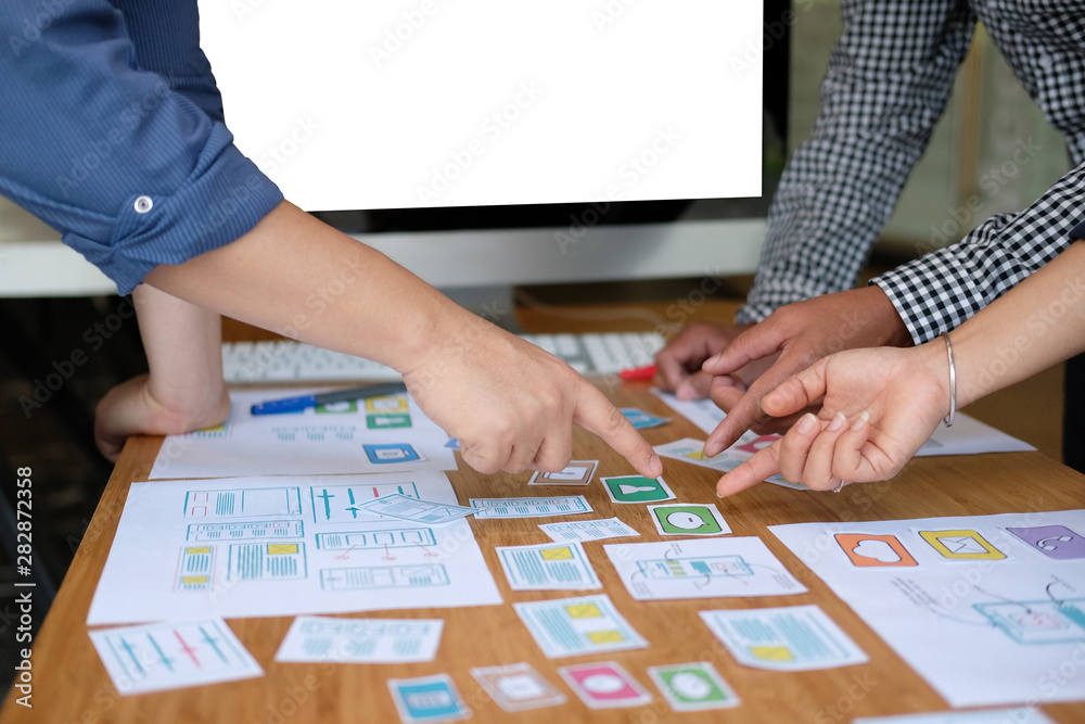 user experience UX designer designing web on smart phone layout. UI developer planning working on mobile application prototype