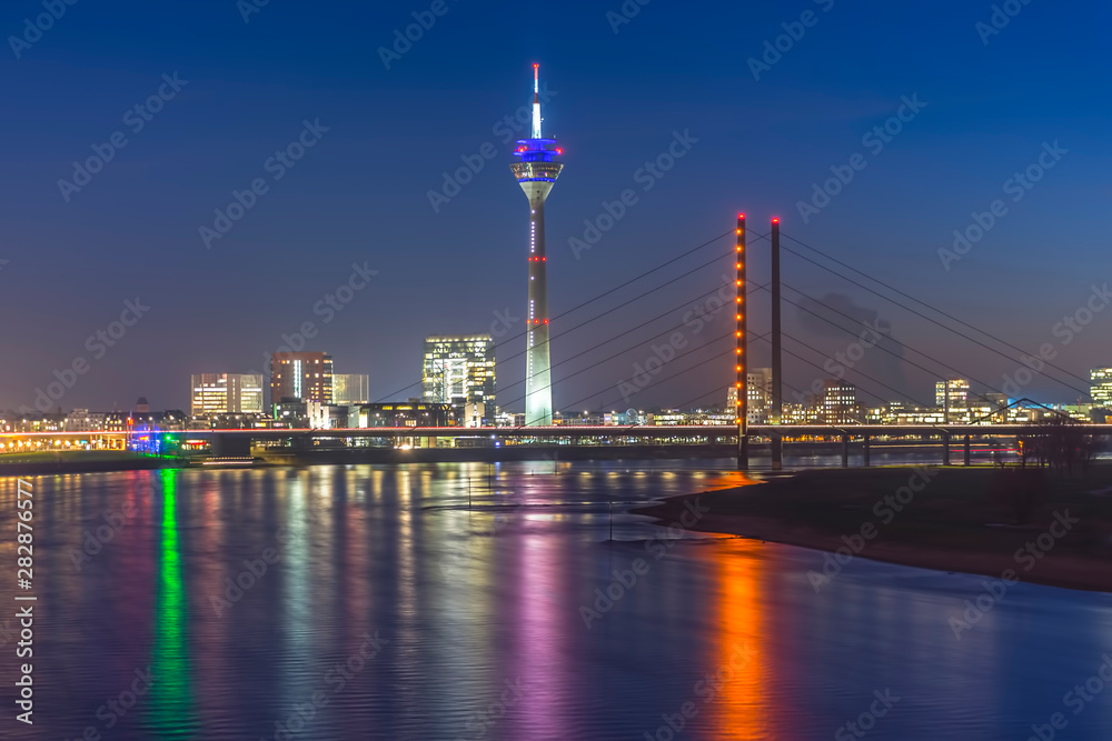 Rheinkniebrücke (Bridge) and Rheintrum TV Tower at the river Rhine during blue hour 