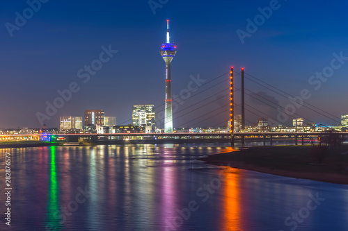 Rheinkniebrücke (Bridge) and Rheintrum TV Tower at the river Rhine during blue hour 