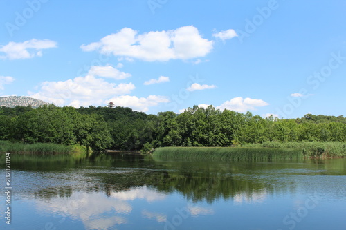 landscape with lake and blue sky © Zhal