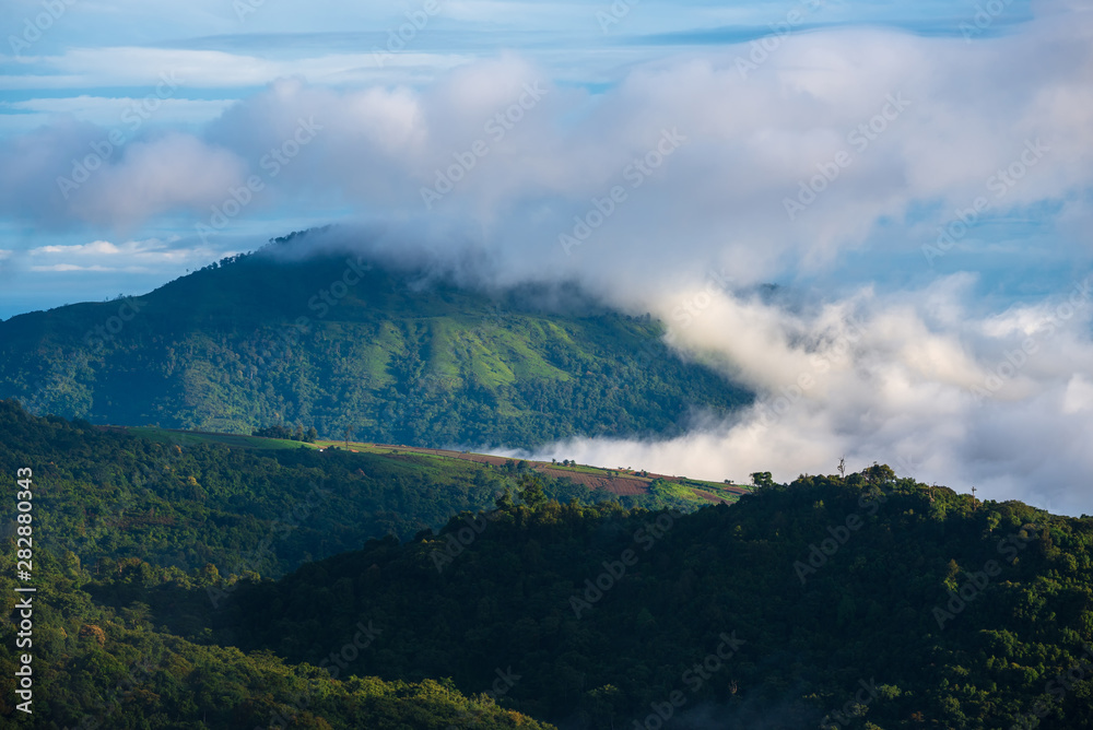 Misty clouds cover mountains in Thailand.