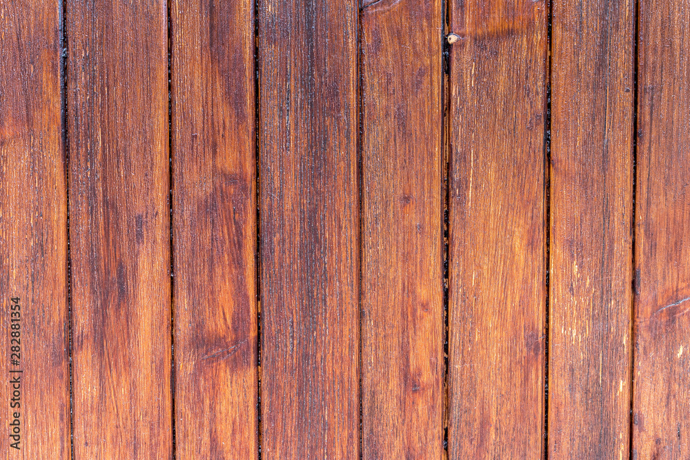 Fototapeta premium Panneau formé de lattes en bois vernis