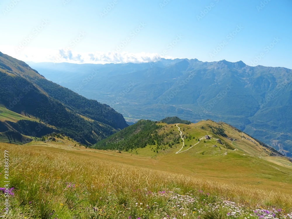 Nature, meadows and peaks that characterize the landscape of the Italian Alps in Val di Susa, near the town of 