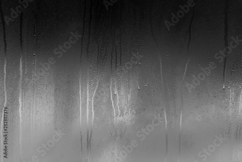 Real glass Window with steam and condensation on surface raining Night 