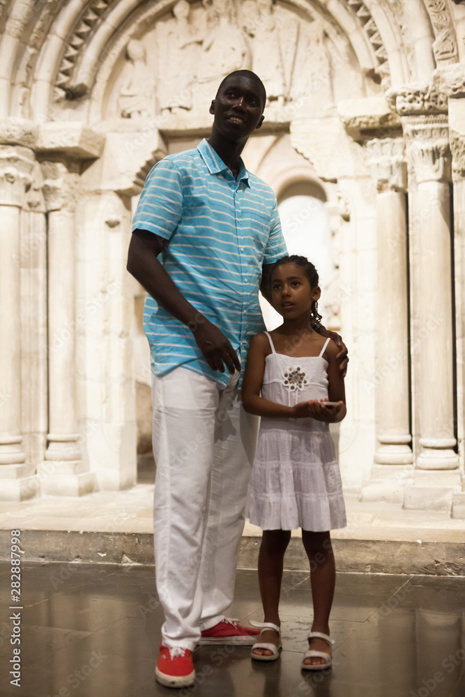 Father and daughter at hall of museum