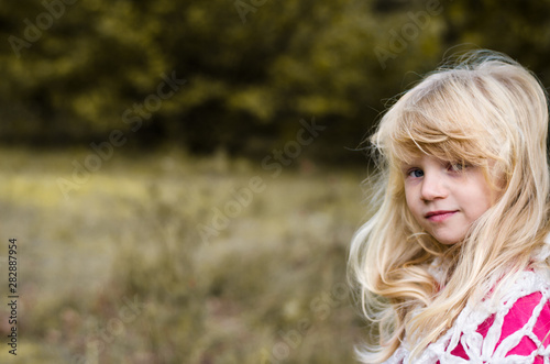 little child  with long blond hair portrait