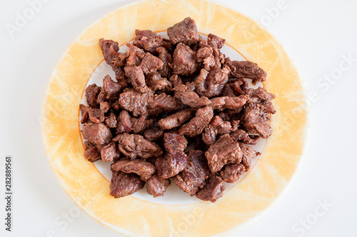 Top shoot of tasty meat on small plate with clear white background.photo is taken in turkey.