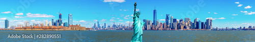 Panorama of The Statue of Liberty with the One world Trade building center over hudson river and New York cityscape background, Landmarks of lower manhattan New York city. © ChayTee
