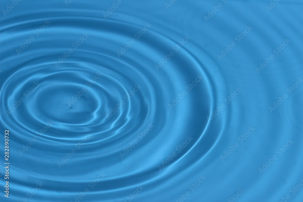 Texture, background with falling water drops and waves with blue water Texture, background with falling water drops and waves with blue water