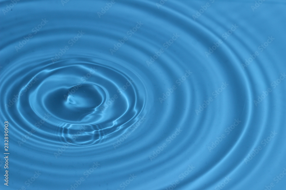 Texture, background with falling water drops and waves with blue water Texture, background with falling water drops and waves with blue water