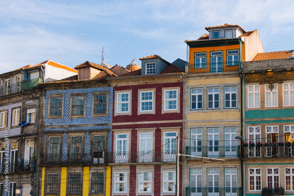 Colorful buildings in Porto, Portugal. Typical portuguese houses. Porto landmark. Multicolored exterior of buildings. Historical apartments.