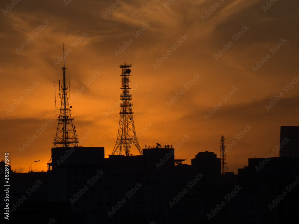antenna towers at beautiful sunset