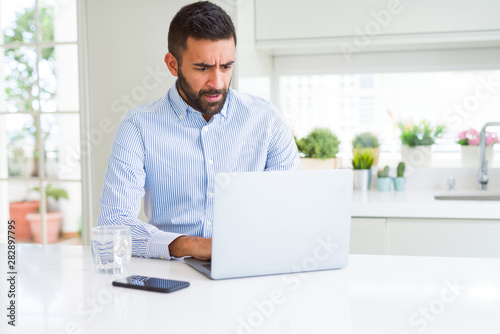 Business man concentrated working using computer laptop