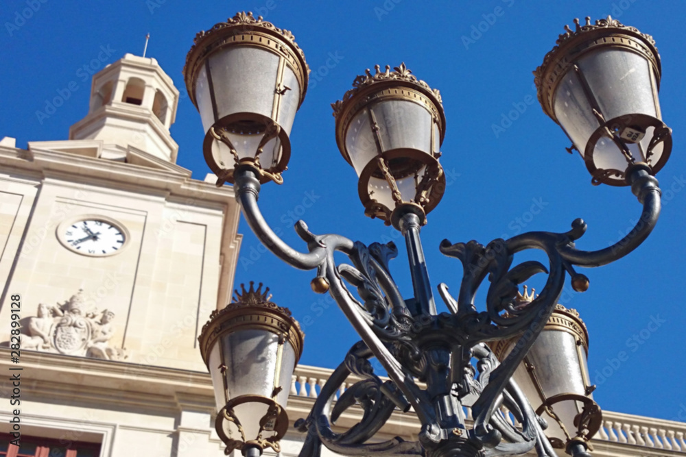 Closeup of historic street lamp in front of the town hall of Reus on the Plaça del Mercadal, Tarragona province, Spain, Europe Closeup of historic street lamp in front of the town hall of Reus on the Plaça del Mercadal, Tarragona province, Spain, Europe
