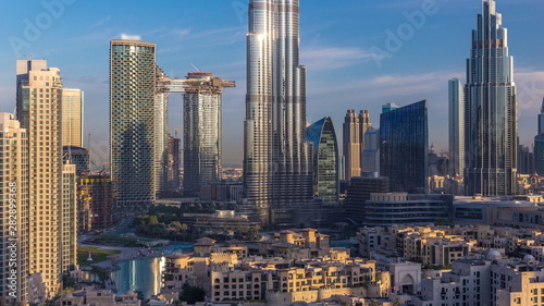 Dubai Downtown skyline during sunrise timelapse with Burj Khalifa and other towers paniramic view from the top in Dubai