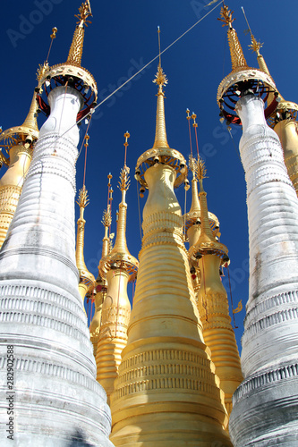 Gold paint shines against a clear blue sky at Shwe Inn Thein monastery on Inle Lake, Burma (Myanmar) on Friday 6 January 2012