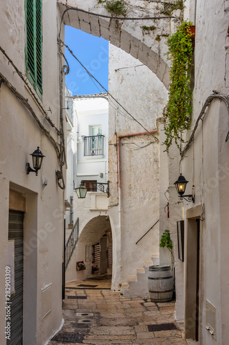 A street surrounded by white houses in the Puglia region of Italy