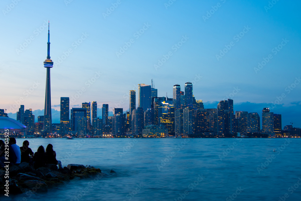Fototapeta premium Evening City View from lake side of Toronto Island, Toronto, Ontario, Canada