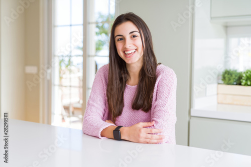 Beautiful young woman wearing pink sweater with a happy and cool smile on face. Lucky person. Free Download Beautiful young woman wearing pink sweater with a happy and cool smile on face. Lucky person. - GFXLoad