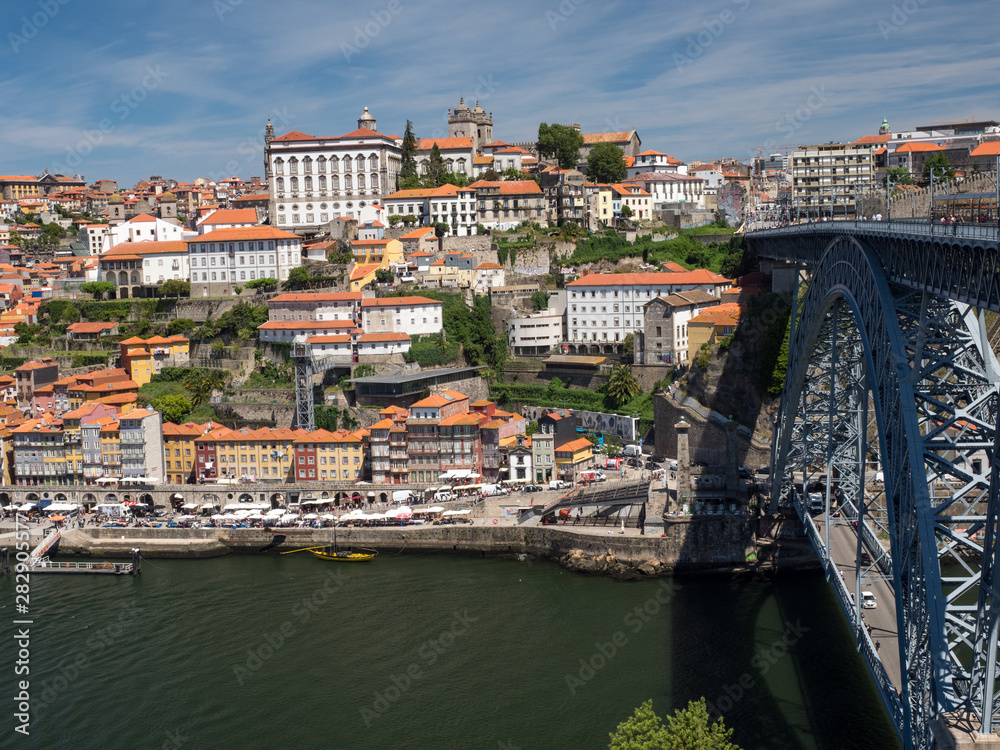 Obraz premium Portugal, may 2019: Scenic view of the Porto Old Town pier architecture over Duoro river in Porto