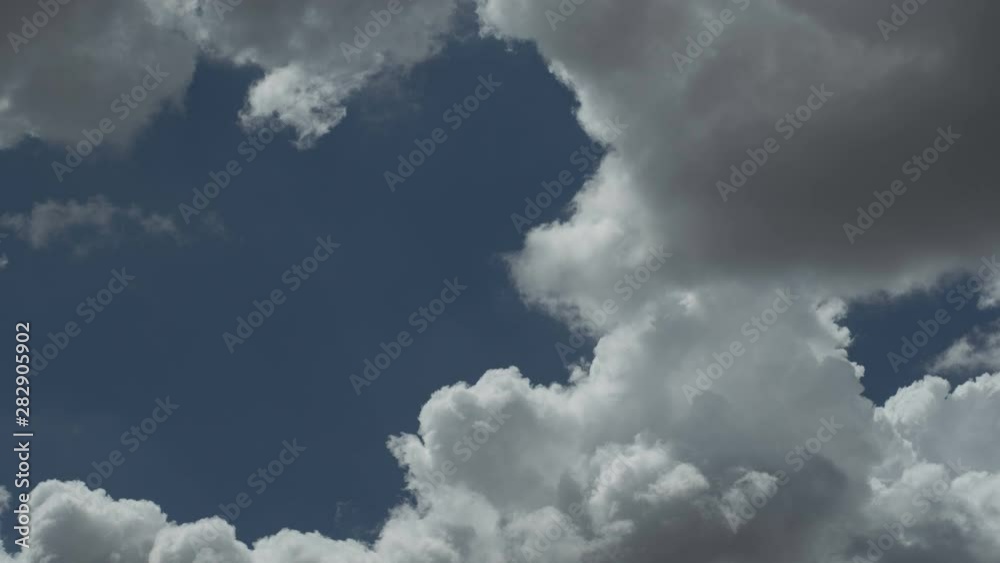 Time lapse of forming cumulus clouds in the summer sky Time lapse of forming cumulus clouds in the summer sky
