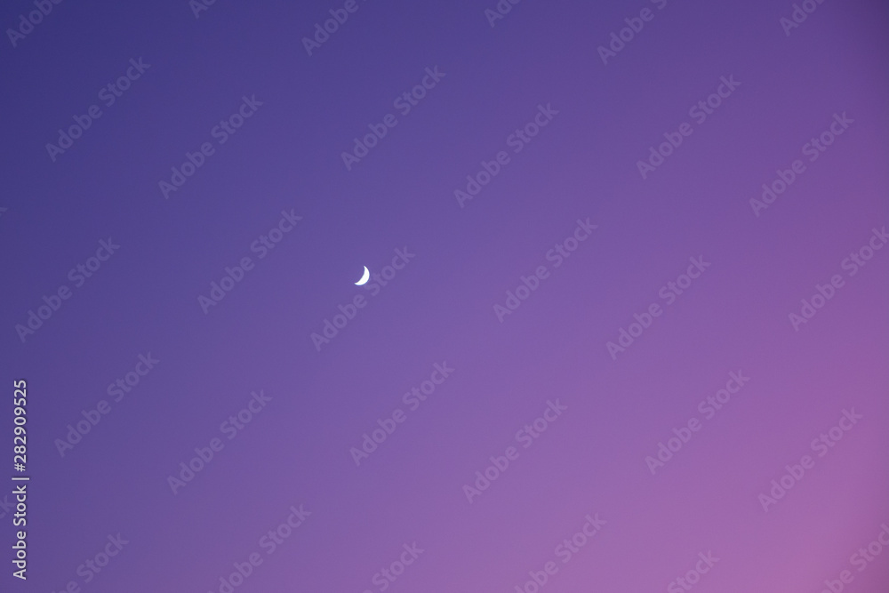 evening sky with a gradient frompink to dark blue with little moon. evening sky with a gradient frompink to dark blue with little moon.