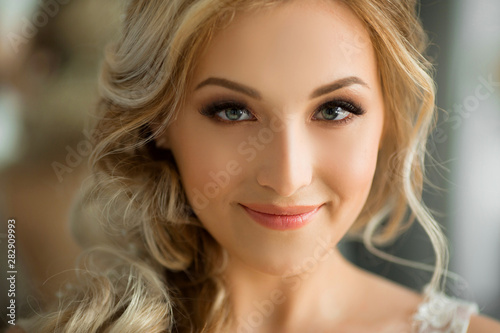 portrait of a beautiful young woman with makeup and hairstyle