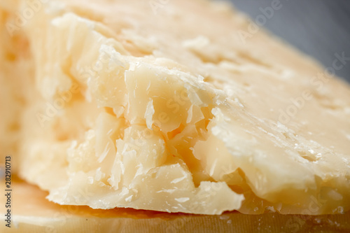 Cheese texture, closeup. Hard seasoned cheese structure in macro shot