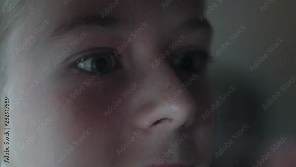 Thunderstorm and lightning reflect on the window. Girl close-up, view from the outside. Thunderstorm and lightning reflect on the window. Girl close-up, view from the outside.
