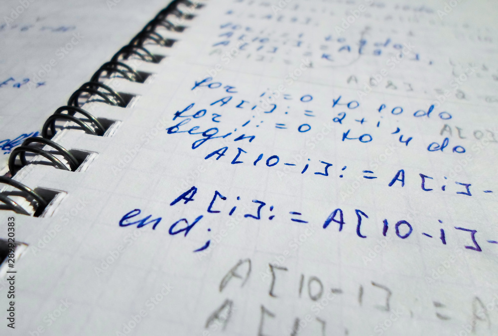 Pascal Notebook Pascal program written in a notebook. side view. the work of the ...