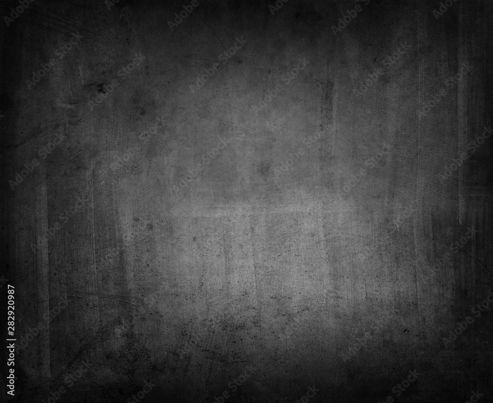 Grunge black concrete textured dark wall background