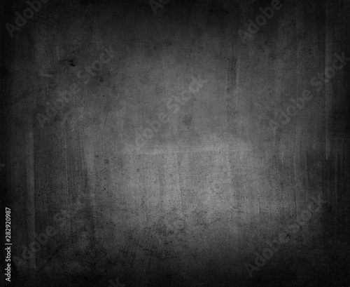 Grunge black concrete textured dark wall background