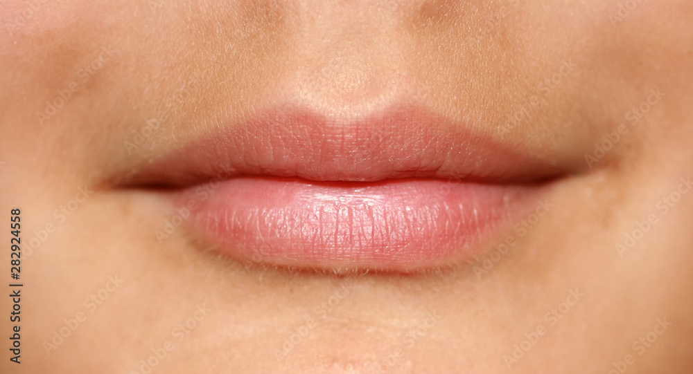 Fototapeta premium A smile on his face. Beautiful lips. Correct lip shape.