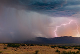 Thunderstorm lightning strike and rain at sunset