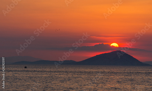 Fishing boat at sunset  in Greece.