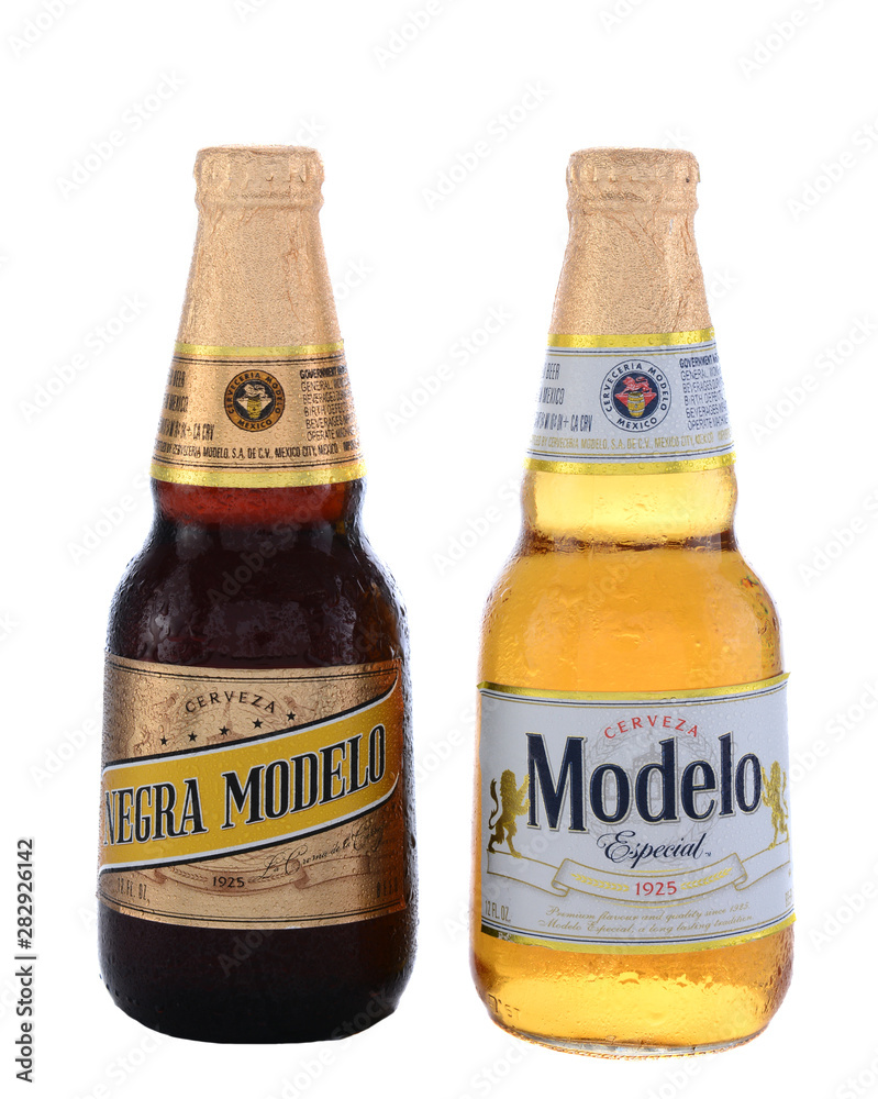 IRVINE, CA - JUNE 14, 2015: A bottle of Modelo Especial and Negra Modelo.  Brewed by Grupo Modelo a large brewery in Mexico owned by Belgian-Brazilian  company Anheuser-Busch InBev. Stock Photo |