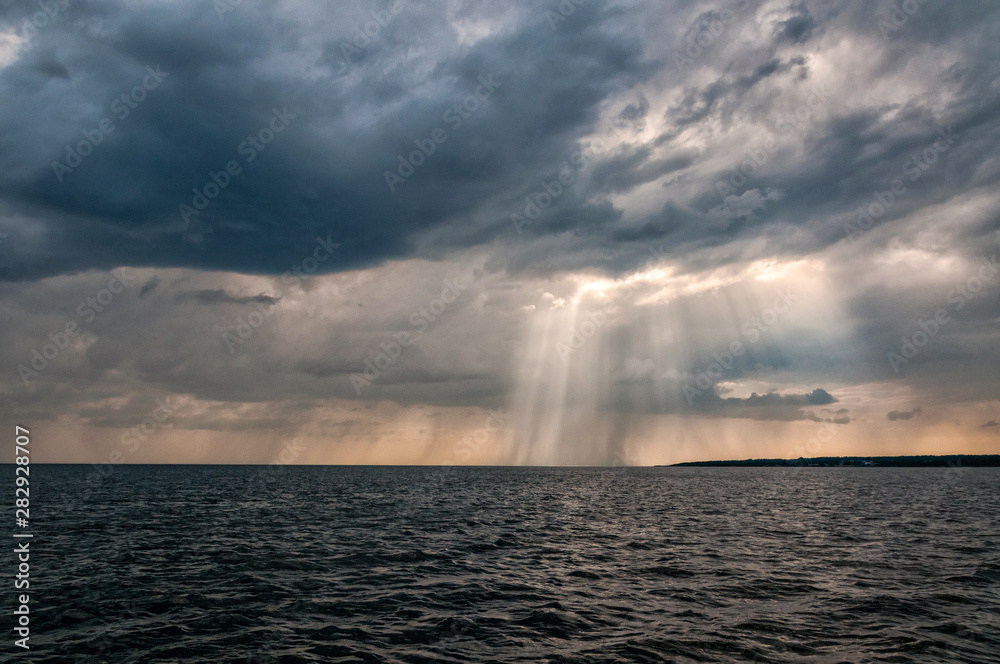 Dramatic sea landscape with sun beams