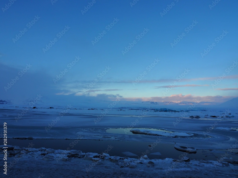 Frozen sea and clouds with iceberg in Iceland in winter Frozen sea and clouds with iceberg in Iceland in winter