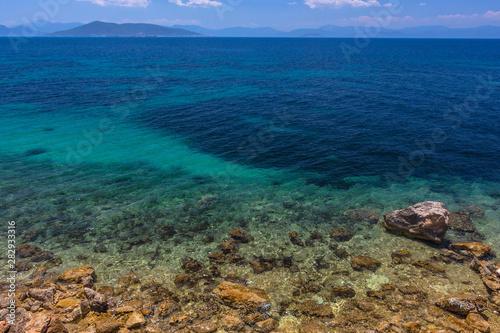 The clear and blue waters of Mediterranean sea in the Saronic gulf, Greece.