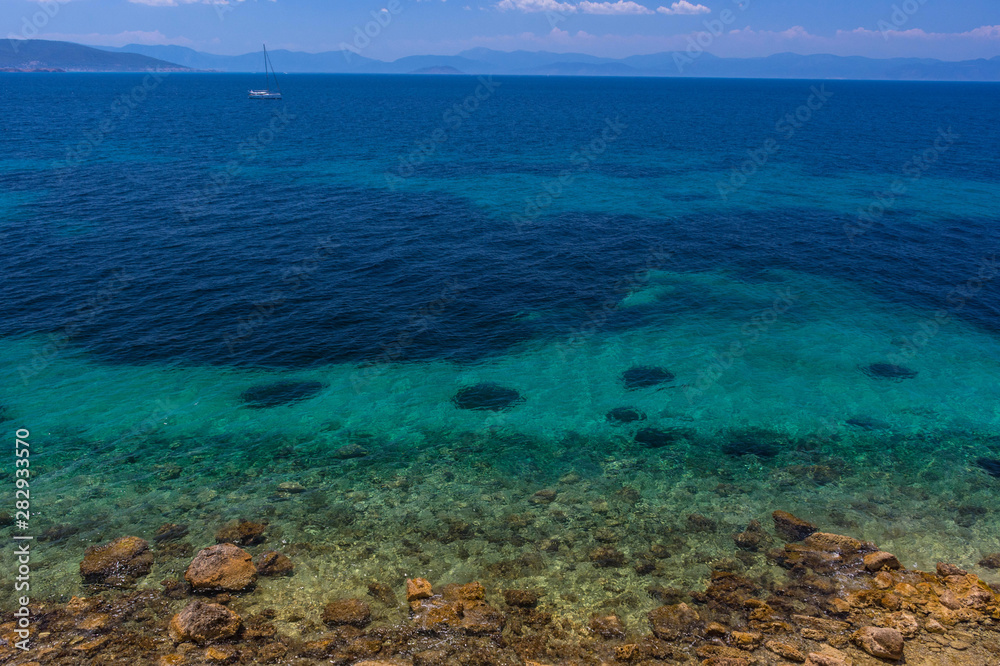 The clear and blue waters of Mediterranean sea in the Saronic gulf, Greece.