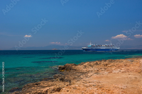 Ferry boat and the clear and blue waters of Mediterranean sea in the Saronic gulf, Greece.