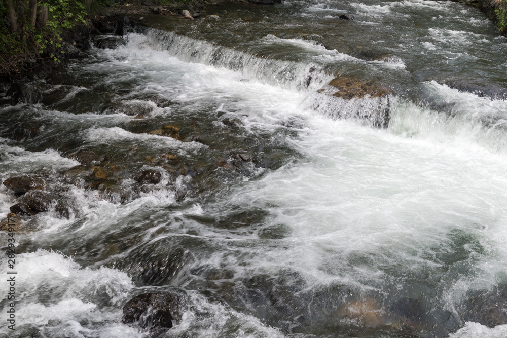 Mountain river stream of water between mountain stones. Mountain river stream of water between mountain stones.