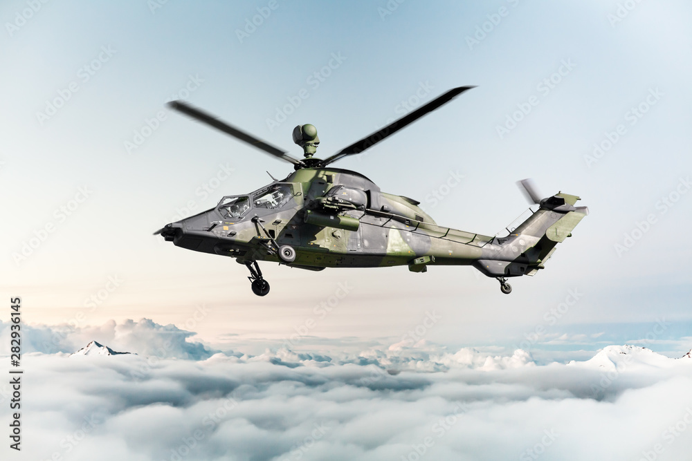 German military armed attack helicopter in flight German military armed attack helicopter in flight