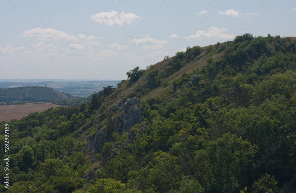 A hill near Klentnice with the Svaty Kopecek near Mikulov at the background in the Czech Republic A hill near Klentnice with the Svaty Kopecek near Mikulov at the background in the Czech Republic