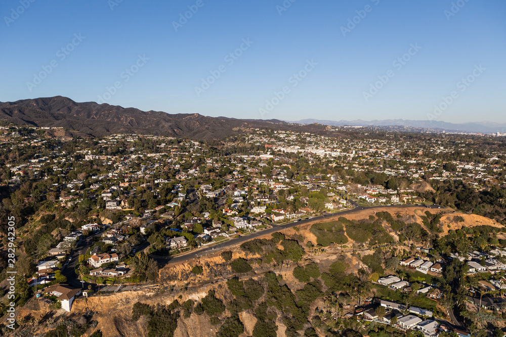 Aerial view of Pacific Palisades homes and the Santa Monica Mountains in Los Angeles California.