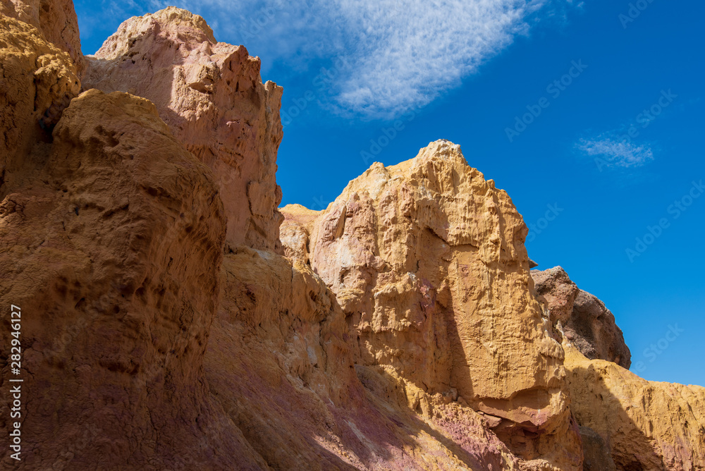 Fototapeta premium Close up low angle landscape of yellow rock formations at Interpretive Paint Mines in Colorado