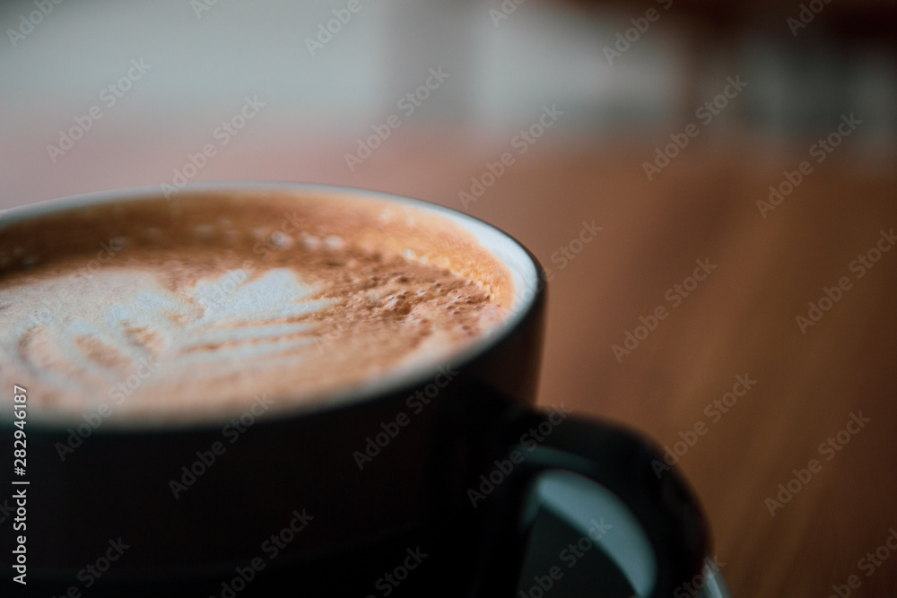 cup of coffee on wooden table cup of coffee on wooden table