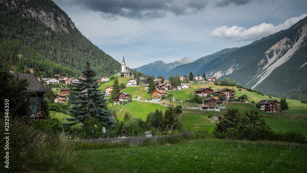 Typical Swiss village in a valley of the Swiss Alps in Switzerland